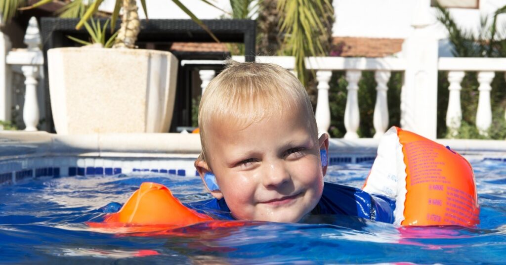 Child swimming in pool