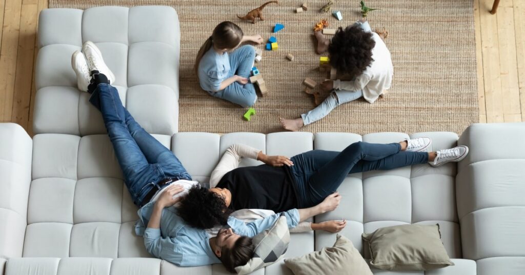 Happy family sitting on the couch.