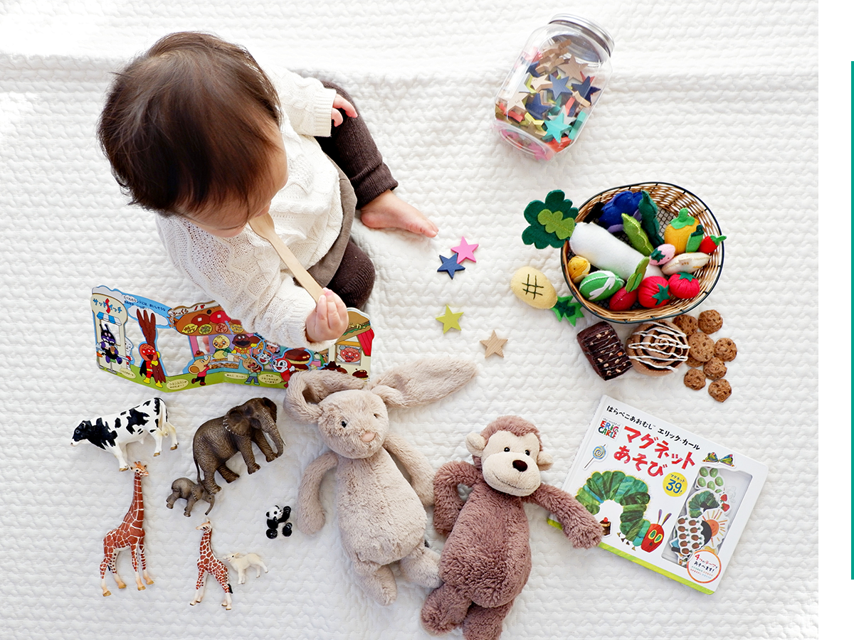 A toddler on a blanket.