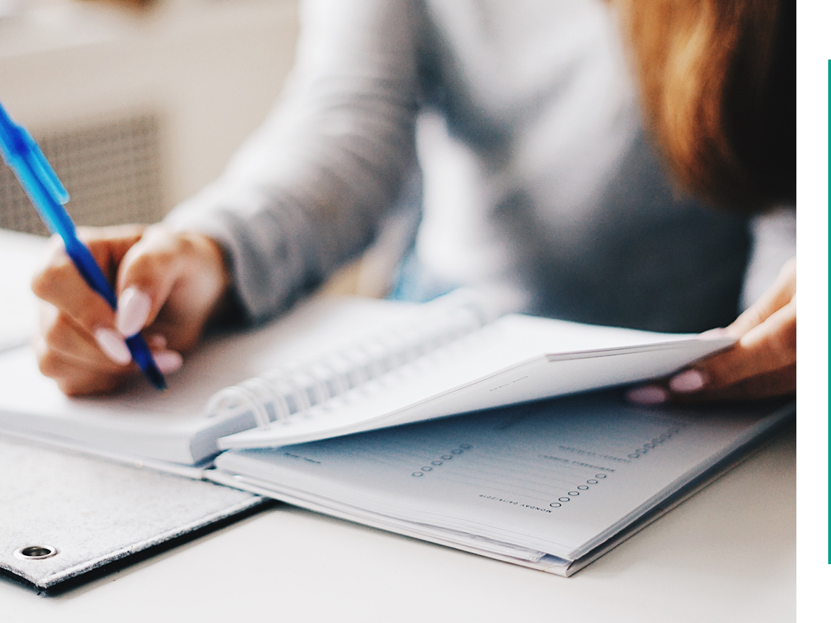 woman organizing notes in her planner